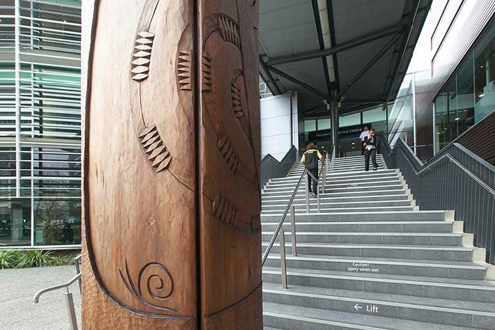 A beautiful wooden carving outside the entrance of Waitakere Civic Centre