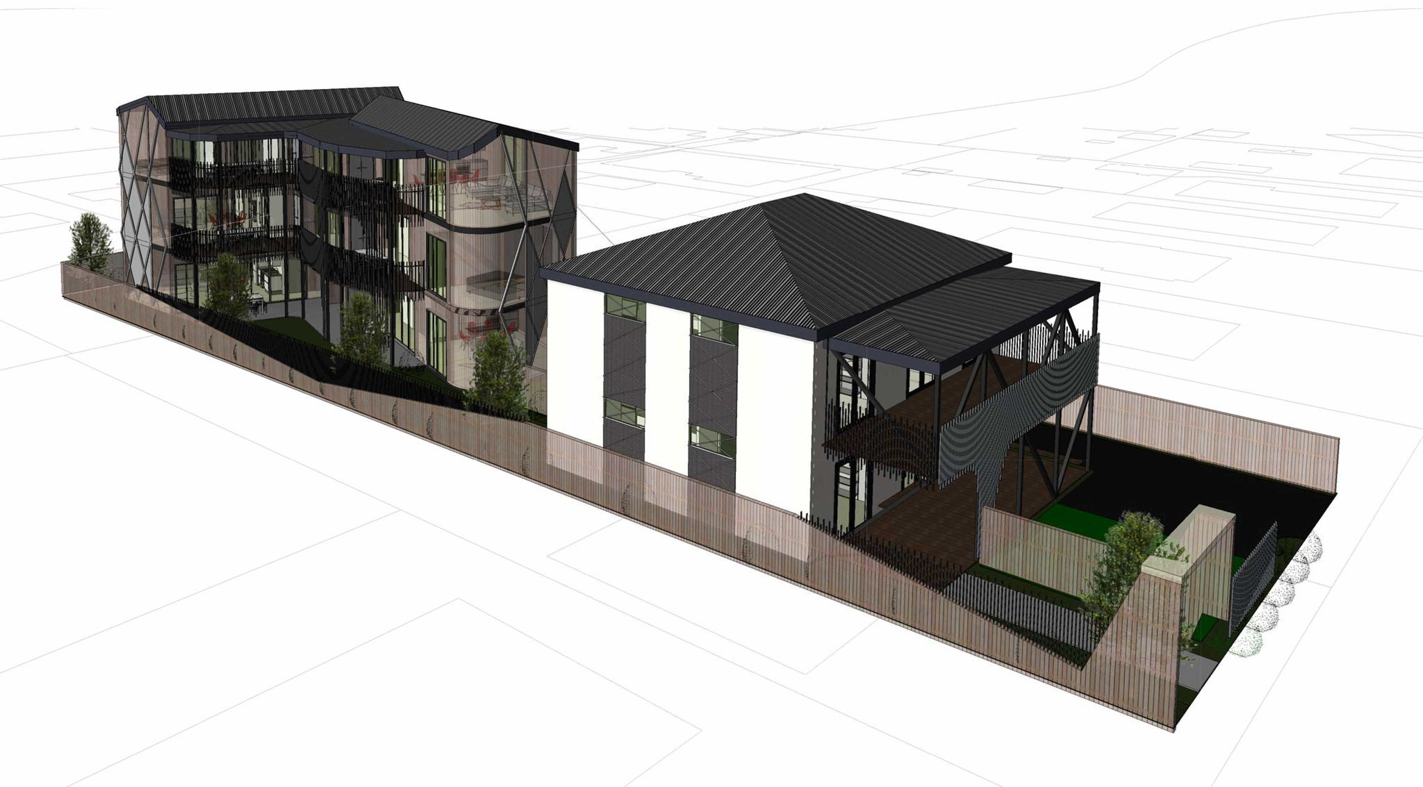 Three quarter view of a development with two buildings with three storeys each, arranged around a communal space.