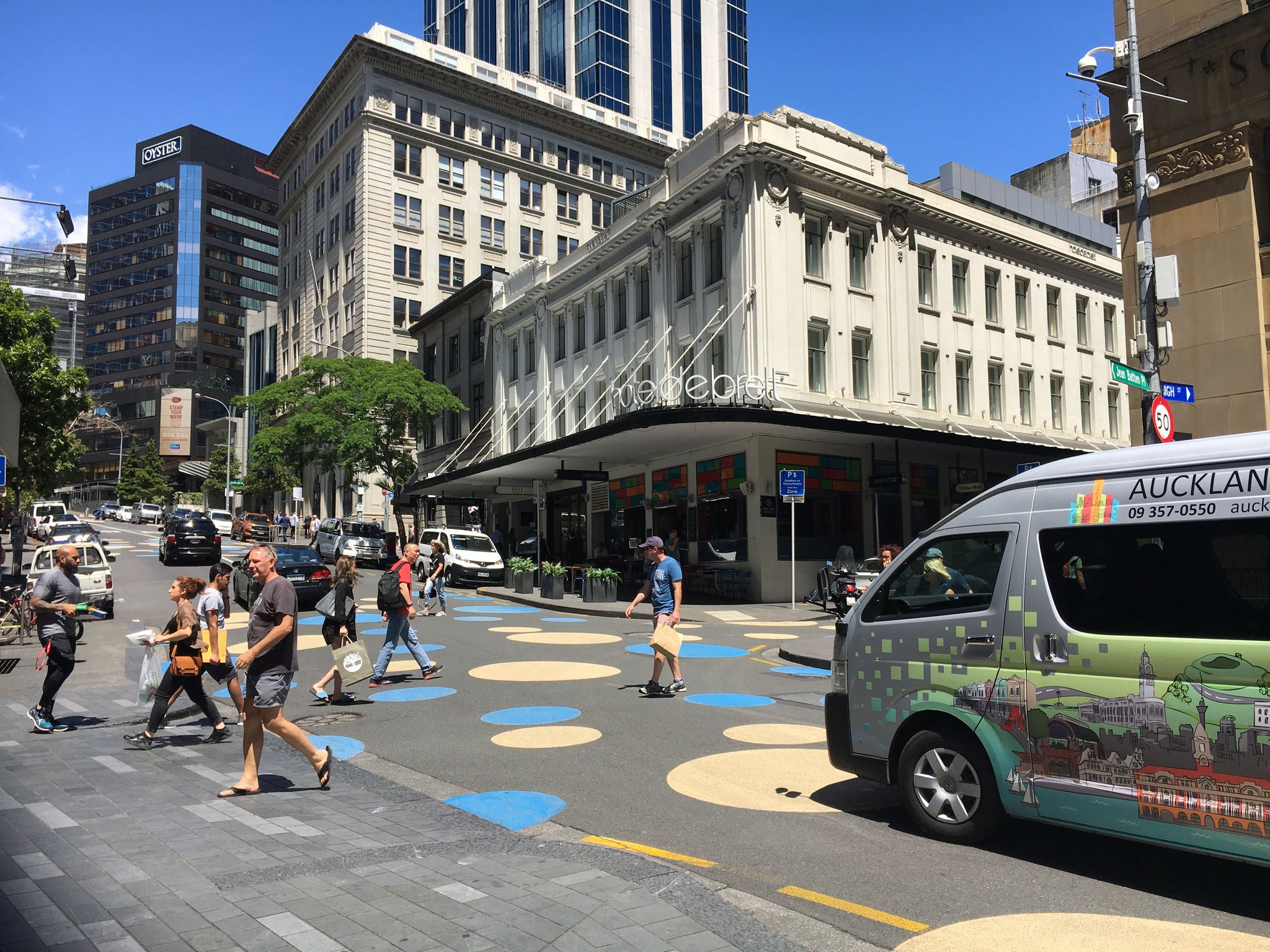 Looking up Shortland St across to Hotel de Brett, seeing traffic calming circles on the road.