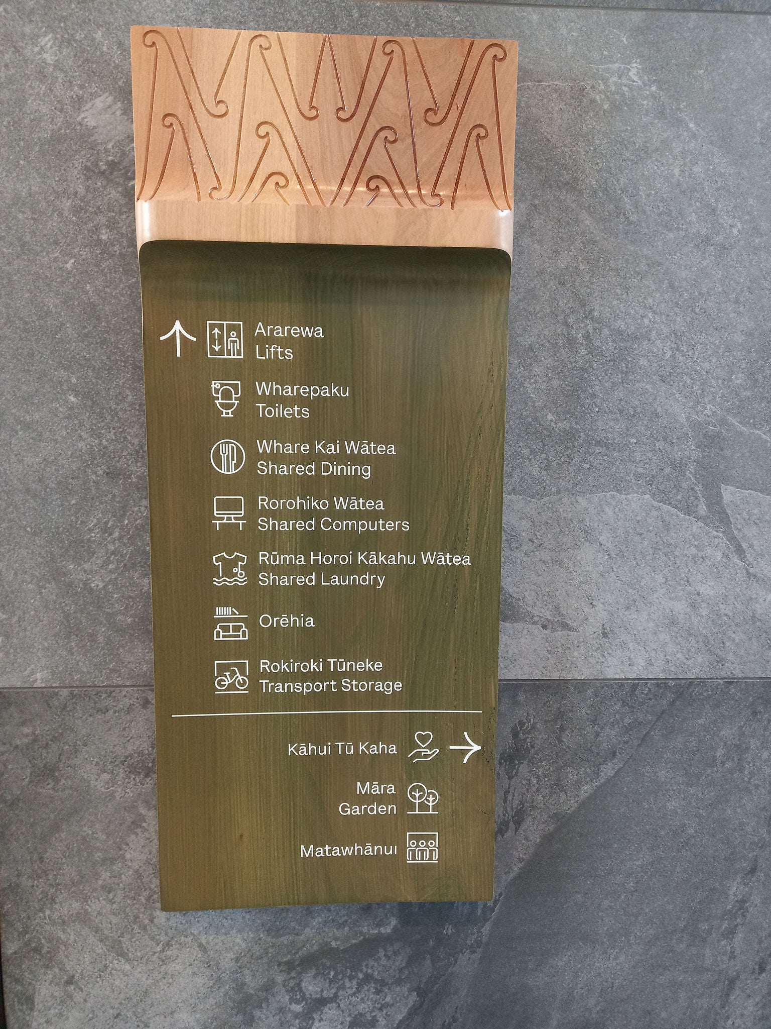 Sentence case improves readability of wayfinding signage. Bilingual signage is supported. To increase accessibility consider providing raised tactile lettering and Braille. 