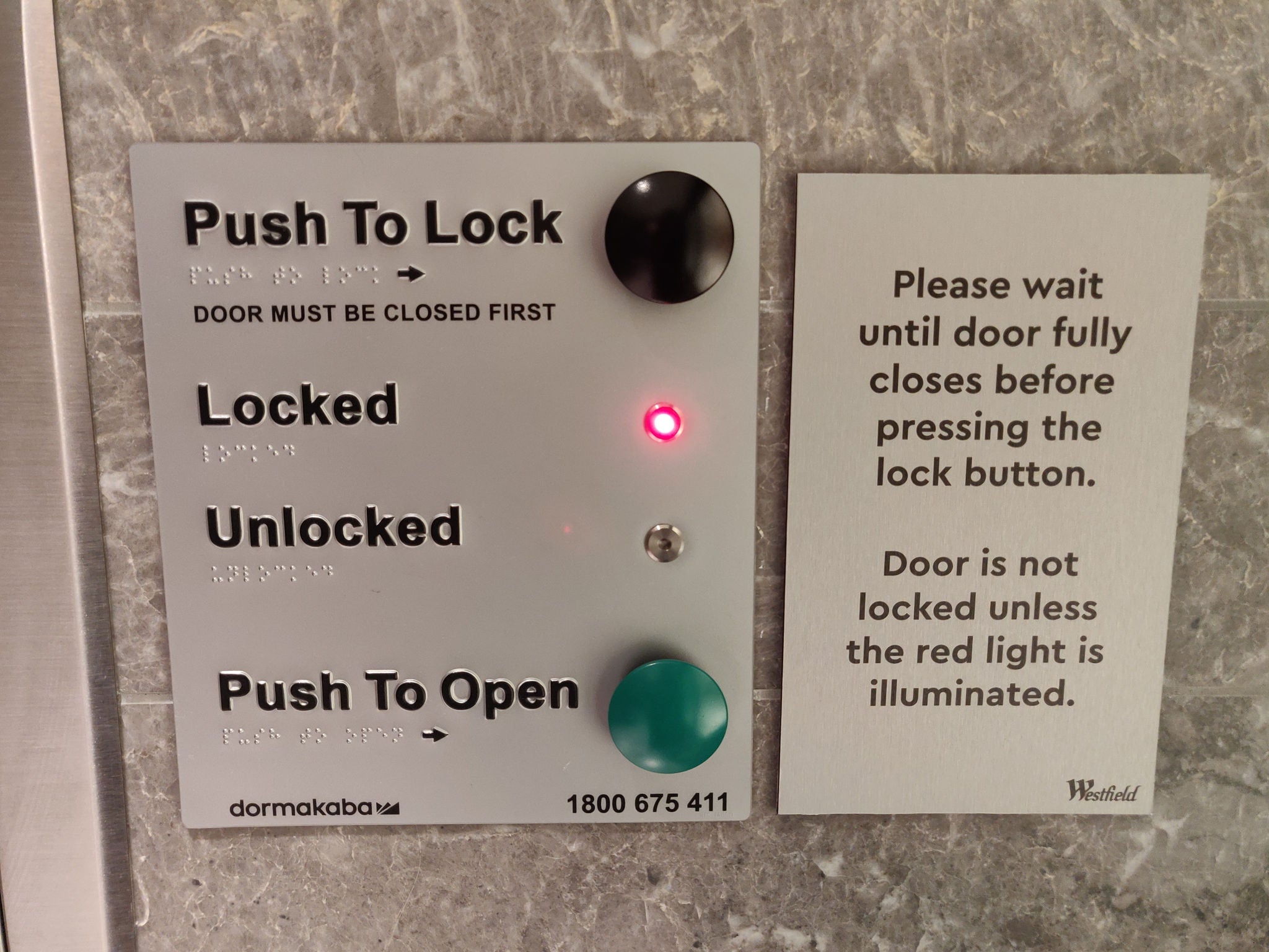 This toilet signage has tactile lettering, Braille and simple instructions for operation. The large buttons can be operated with decreased hand function/closed fist. The light confirms whether the toilet is locked or unlocked.