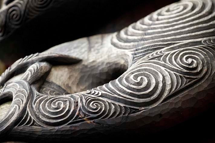 A close up shot of details of a carving of Arataki Visitors Centre, Waitakere